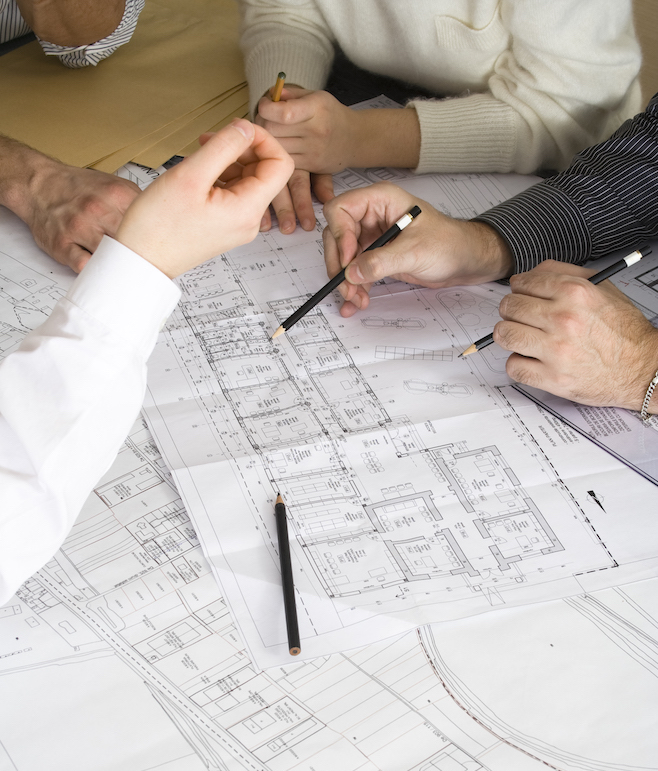 Building Element team reviewing architectural blueprints